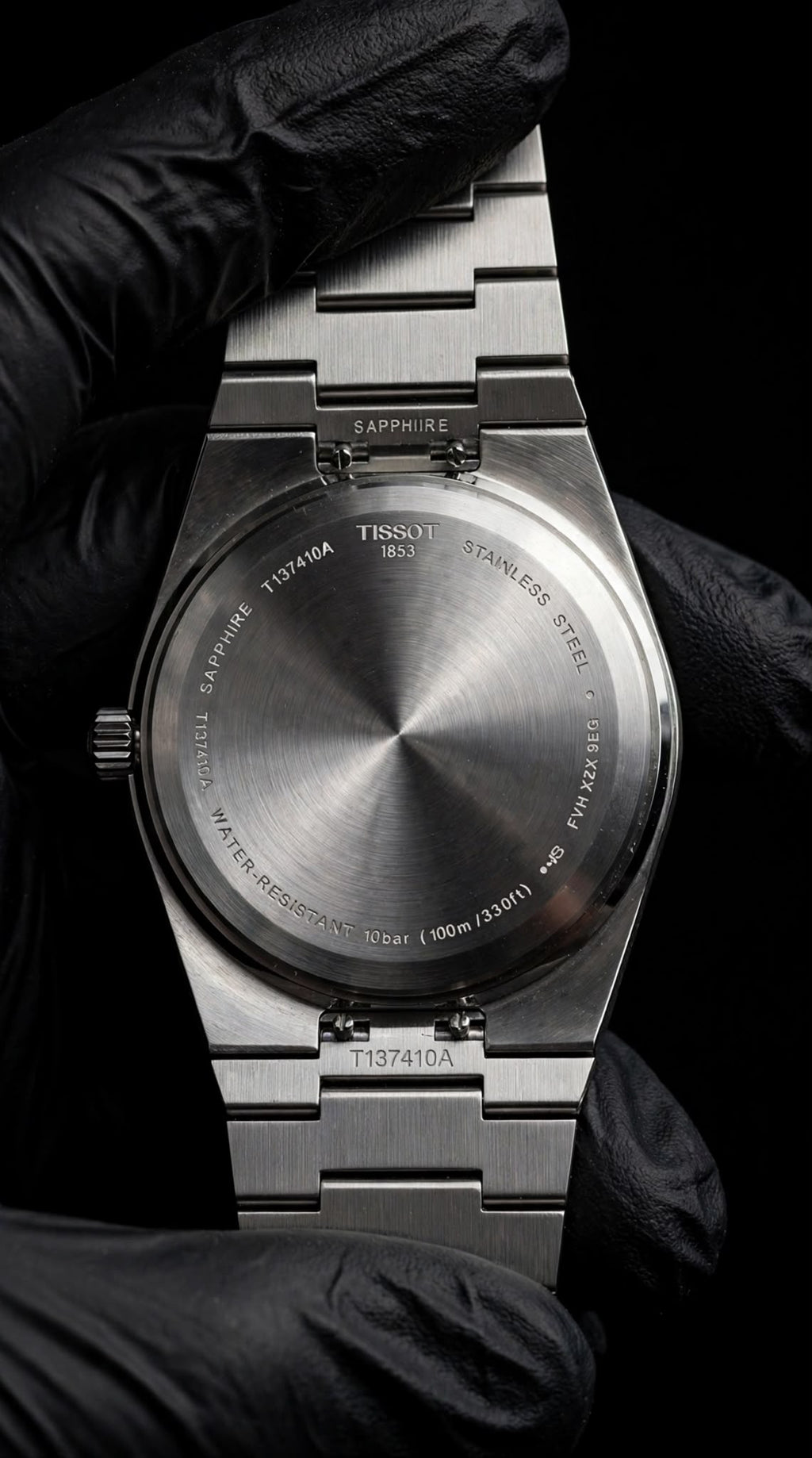 Tissot PRX kasa arkası ve bilezik görünümü